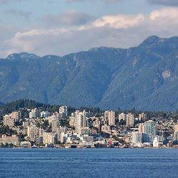 Cityscape with mountain range in background