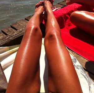 Low section of woman relaxing on table