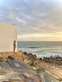 Scenic view of sea against sky with a man