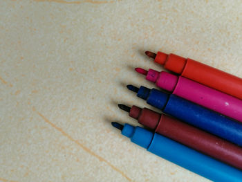 High angle view of colored pencils on table