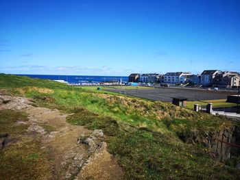 Scenic view of sea against blue sky