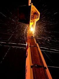 Factory against sky at night