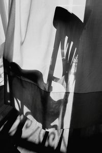 Close-up of woman hand with shadow