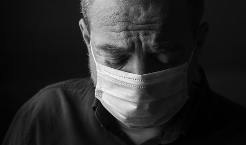 Unhappy male doctor in a medical mask