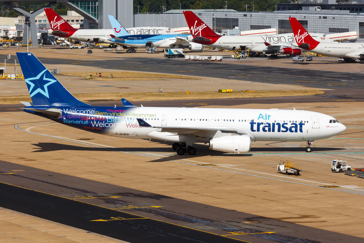 HIGH ANGLE VIEW OF AIRPLANE AT AIRPORT