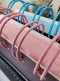 Close-up of note books with rings in blue and pink color. 