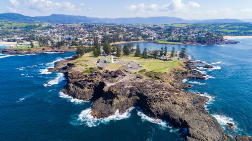 High angle view of sea and buildings against sky