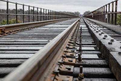 Surface level of railroad tracks against sky