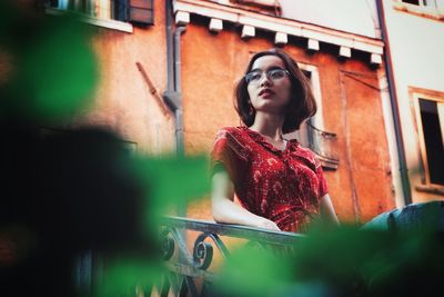 Portrait of young woman standing outdoors