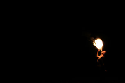 Illuminated fire at night