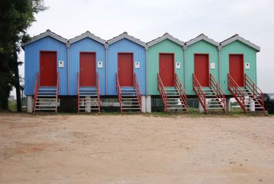 Lifeguard hut on beach against sky