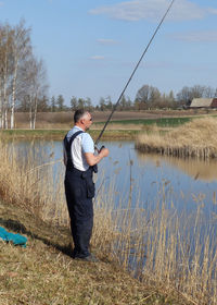 Portrait of man standing on field