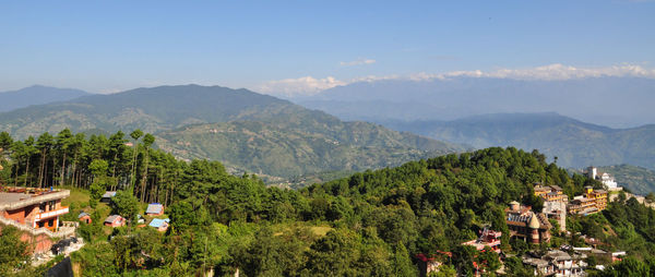 Scenic view of mountains against cloudy sky