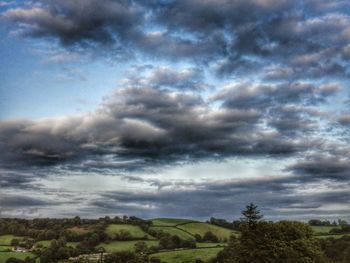 Scenic view of landscape against cloudy sky