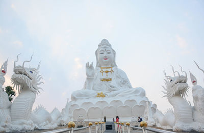 Statue of buildings against sky