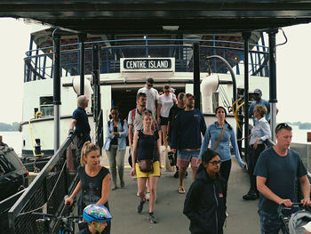 People standing on railroad station platform