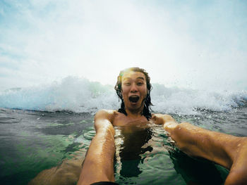 Portrait of man swimming in sea