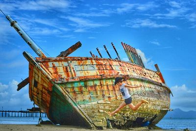 Built structures against cloudy sky