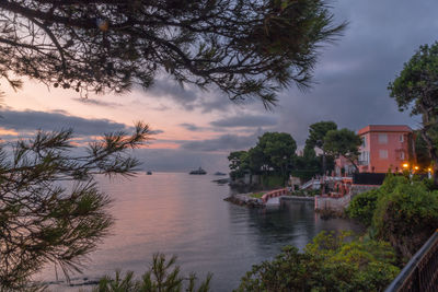 Scenic view of sea and buildings against sky