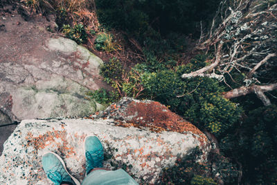 Low section of man on rock