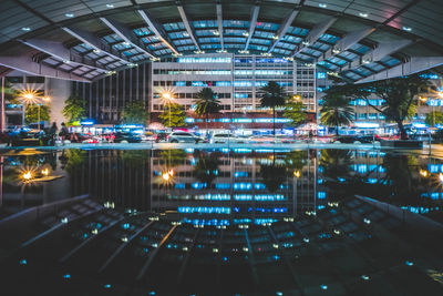 Illuminated swimming pool at night