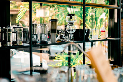 Close-up of glass bottles on table in restaurant