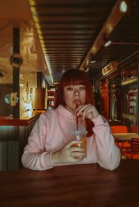 Portrait of mid adult man sitting in restaurant