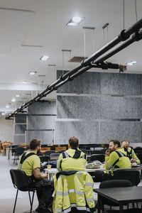 Construction workers in cafeteria