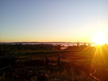 Scenic view of landscape at sunset