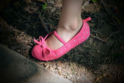 Close-up of pink shoe