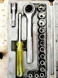 High angle view of tools in container