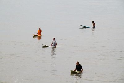 People swimming in sea