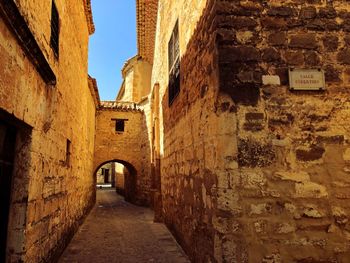 Narrow alley amidst old buildings