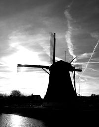 Low angle view of windmill against sky