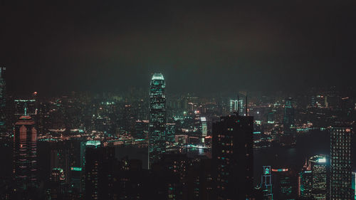 Aerial view of city lit up at night