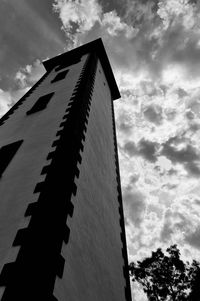 Low angle view of building against cloudy sky