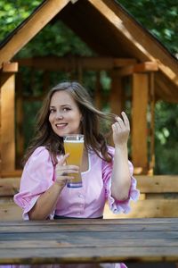 Portrait of young woman using mobile phone