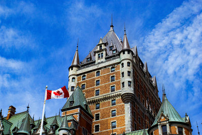 Low angle view of buildings against blue sky