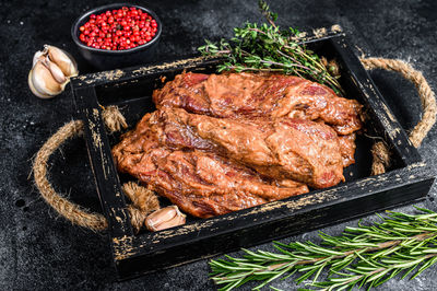 High angle view of meat on barbecue grill