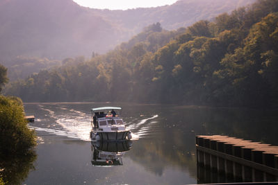 The doubs valley which winds between hills topped with wild woods and rocky bars. 