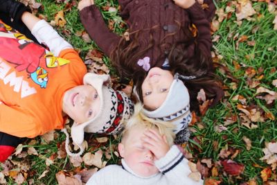 High angle view of girl lying on field