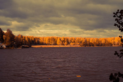 Scenic view of lake against sky during sunset