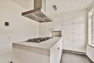 Modern kitchen in empty room