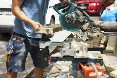 Man sawing wood