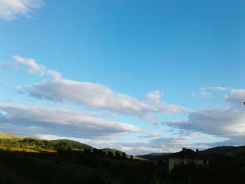 Scenic view of landscape against blue sky