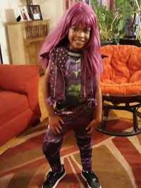 Portrait of smiling woman standing at home