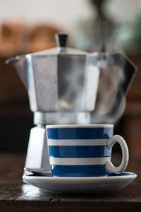 Close-up of coffee cup on table