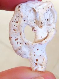 Close-up of hand holding ice cream