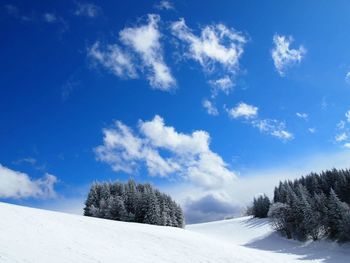 Scenic view of snow covered landscape against sky