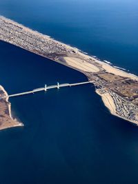 High angle view of sea against blue sky